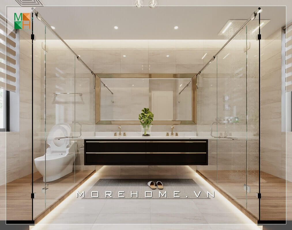 Mẫu thiết kế phòng tắm master với không gian nội thất vô cùng cao cấp, được bố trí khoa học với khu lavabo ở giữa, hai bên là khu vệ sinh và khu tắm được ngăn cách bằng kính cường lực giúp hạn chế nước bắn để sàn nhà luôn được khô ráo sạch sẽ